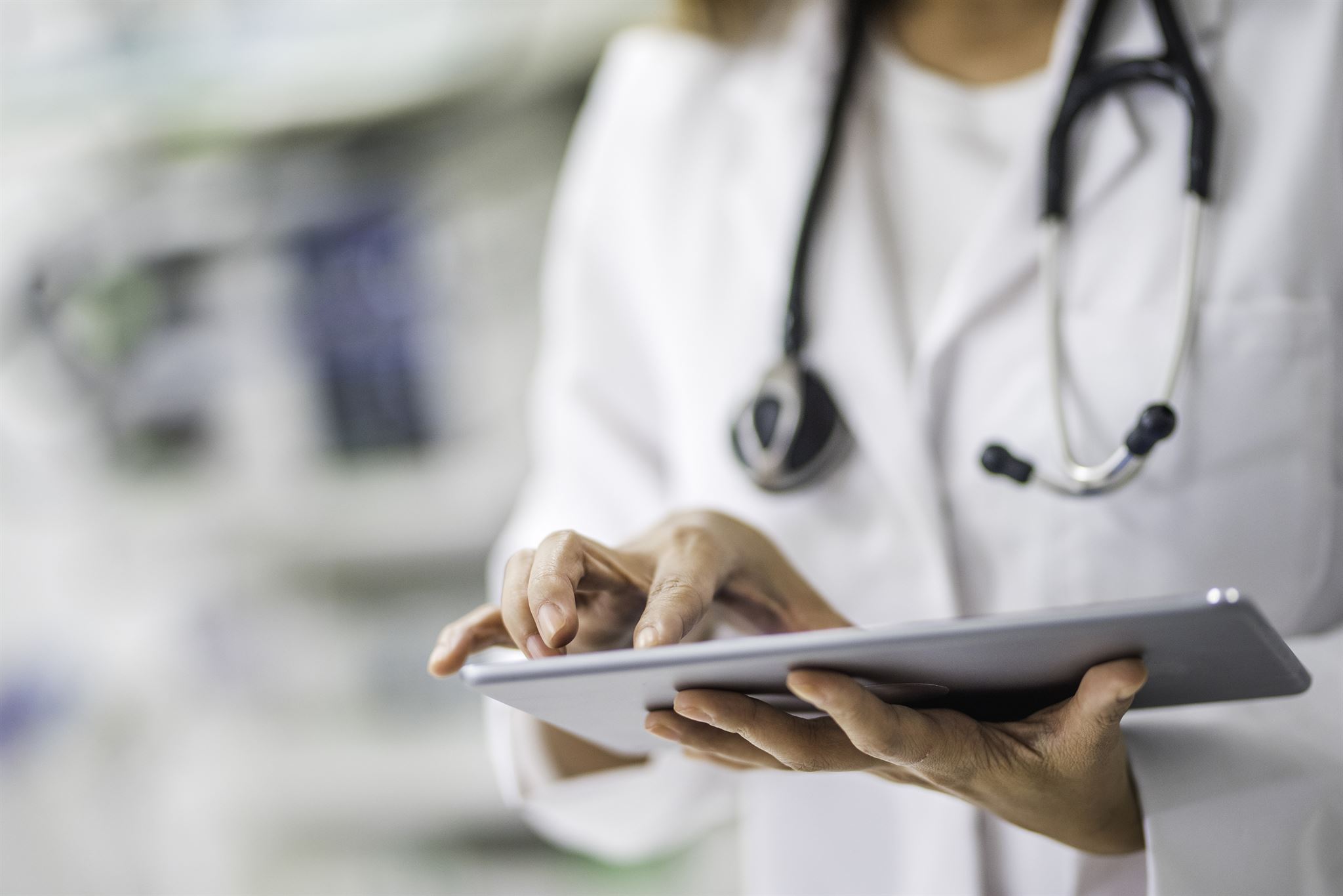 Medical professional using tablet